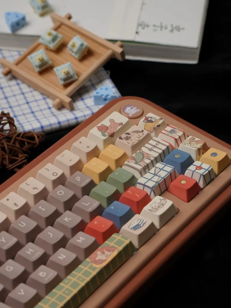 Angled detail of Playful Pups cream and taupe keycaps with colorful accents
