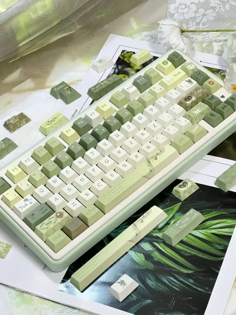 Angled view of Quiet Depths green and ivory keycaps on a keyboard