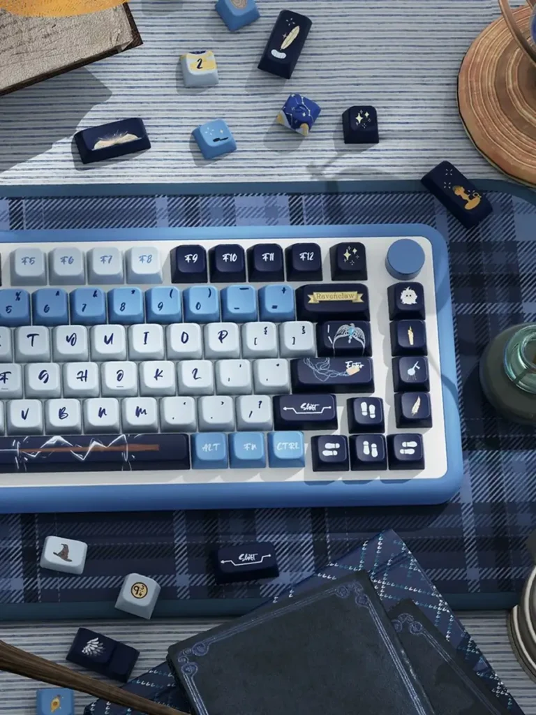 Right-side detail of Ravenclaw keycaps with illustrated novelty keys