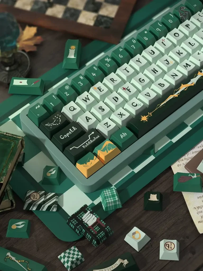 Angled detail of Slytherin keycaps with spell-inspired legends and gold accents