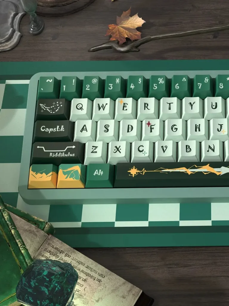 Left-side detail of Slytherin keycaps with illustrated modifiers and gold spacebar design